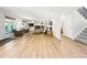 Spacious living room featuring wood flooring, brick fireplace, and built-in shelving at 2011 Sundrop Trl, Highlands Ranch, CO 80126