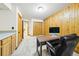 Spacious office features wooden accents, a closet, and a large desk at 2011 Sundrop Trl, Highlands Ranch, CO 80126