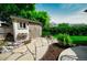 Charming backyard shed with a stone path and decorative landscaping at 2011 Sundrop Trl, Highlands Ranch, CO 80126