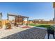 Inviting backyard featuring a pergola and well-maintained lawn at 261 Mesa Ave, Lochbuie, CO 80603