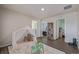 Spacious playroom with plush carpet, neutral walls, and access to multiple rooms in the home at 261 Mesa Ave, Lochbuie, CO 80603