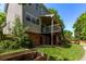 View of the backyard with a patio, lawn, garden boxes and a deck with stairs leading down to the yard at 10345 Lions Heart, Lone Tree, CO 80124
