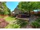 Backyard view of the home featuring a hot tub and lush lawn at 10345 Lions Heart, Lone Tree, CO 80124