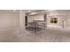 Finished basement featuring a ping pong table and window at 10345 Lions Heart, Lone Tree, CO 80124