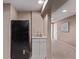Finished basement bar area features a small refrigerator, sink, and white cabinetry at 10345 Lions Heart, Lone Tree, CO 80124
