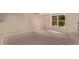 Large basement area with natural light coming through a window at 10345 Lions Heart, Lone Tree, CO 80124