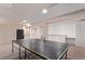 Finished basement featuring a ping pong table and kitchenette at 10345 Lions Heart, Lone Tree, CO 80124