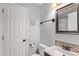 Cozy bathroom features tiled floors and walls, modern fixtures and lighting, creating a clean and functional space at 10345 Lions Heart, Lone Tree, CO 80124