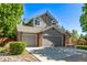 Exterior of the home with a large garage and landscaped yard at 10345 Lions Heart, Lone Tree, CO 80124