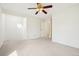 Spacious bedroom featuring neutral carpeting, ceiling fan and ample natural light at 1529 S Sable Blvd # C, Aurora, CO 80012