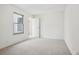Bright bedroom featuring neutral carpet and a window for natural light at 1529 S Sable Blvd # C, Aurora, CO 80012