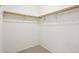 Empty walk-in closet featuring a carpeted floor and shelving at 1529 S Sable Blvd # C, Aurora, CO 80012