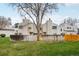 A view of the rear exterior of the townhome, with a grassy yard at 1529 S Sable Blvd # C, Aurora, CO 80012