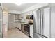 Kitchen with stainless steel appliances, tile backsplash, and lots of storage at 1529 S Sable Blvd # C, Aurora, CO 80012