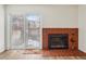View of fireplace and sliding glass door at 1529 S Sable Blvd # C, Aurora, CO 80012