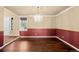 Dining area with wood flooring and a decorative accent wall, perfect for entertaining guests at 16273 E Prentice Pl, Centennial, CO 80015