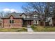 Charming two-story home with a brick and gray exterior, landscaped front yard and inviting curb appeal at 16273 E Prentice Pl, Centennial, CO 80015