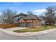 Exterior view of home featuring an attached three-car garage and well-maintained lawn at 16273 E Prentice Pl, Centennial, CO 80015