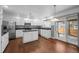 Bright, updated kitchen featuring white cabinets, stainless appliances, and granite countertops at 16273 E Prentice Pl, Centennial, CO 80015