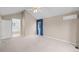 Bright main bedroom with vaulted ceilings and carpet flooring; access to full bathroom with garden tub and shower at 16273 E Prentice Pl, Centennial, CO 80015
