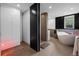 Contemporary bathroom with a modern tub, vanity, shower, and tiled floors at 600 Garfield St, Denver, CO 80206