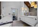 Elegant bathroom featuring a soaking tub, double vanity, and modern fixtures at 600 Garfield St, Denver, CO 80206