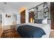 A beautifully decorated bedroom features modern decor, a large painting, and a unique bedside bench at 600 Garfield St, Denver, CO 80206