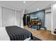 Bedroom featuring wood floors and a desk at 600 Garfield St, Denver, CO 80206