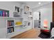 Bedroom featuring floating shelves and an ensuite bathroom at 600 Garfield St, Denver, CO 80206