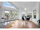 Bright dining area featuring a round table, modern chairs, and large windows with natural light at 600 Garfield St, Denver, CO 80206