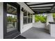 Charming covered front porch with painted brick and black trim at 600 Garfield St, Denver, CO 80206