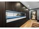 Hallway with wood floors, and large dark storage cabinets at 600 Garfield St, Denver, CO 80206