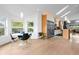 Bright kitchen features a modern stainless steel refrigerator and a cozy breakfast nook with pendant lighting at 600 Garfield St, Denver, CO 80206