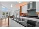 Bright, modern kitchen with stainless steel appliances, large island, and open layout at 600 Garfield St, Denver, CO 80206
