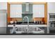 Stylish kitchen with stainless steel appliances, sleek countertops, and a modern backsplash at 600 Garfield St, Denver, CO 80206