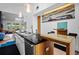 Elegant kitchen boasts a large island, stainless steel appliances, and views into the adjacent living area at 600 Garfield St, Denver, CO 80206
