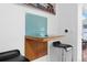 Kitchen space with a glass countertop, stylish bar stools, and light blue backsplash at 600 Garfield St, Denver, CO 80206