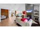 Bright living room with fireplace, modern furnishings, and open floor plan at 600 Garfield St, Denver, CO 80206