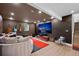 Cozy living room with a large screen, comfortable seating, and a guitar collection at 600 Garfield St, Denver, CO 80206