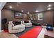 Entertainment room with comfortable seating, a large painting, and a guitar collection at 600 Garfield St, Denver, CO 80206