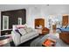 Spacious living room with modern furnishings, wooden floors, and black accent wall at 600 Garfield St, Denver, CO 80206