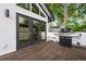 Outdoor kitchen area with built-in grill and wooden deck at 600 Garfield St, Denver, CO 80206