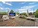 Inviting rooftop deck with outdoor seating, a dining area, and large-screen entertainment at 600 Garfield St, Denver, CO 80206
