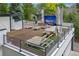 Rooftop deck featuring comfortable seating, dining area, and entertainment options at 600 Garfield St, Denver, CO 80206