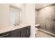 Bathroom features a walk-in shower with bench, modern vanity and stylish accents at 2924 S Poppy St, Morrison, CO 80465