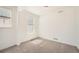 Bedroom with neutral carpet, fresh white walls and two sunny windows overlooking the neighborhood at 2924 S Poppy St, Morrison, CO 80465