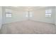 Bright, spacious bedroom with neutral carpet, multiple windows, and recessed lighting at 2924 S Poppy St, Morrison, CO 80465