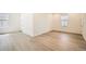 Bedroom with wood grain flooring, two sunny windows and white baseboards throughout the room at 2924 S Poppy St, Morrison, CO 80465