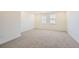 Spacious bedroom features neutral walls, carpet, recessed lighting, and two windows at 2924 S Poppy St, Morrison, CO 80465