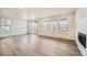 Bright living room featuring wood floors, recessed lighting, and large windows with picturesque views at 2924 S Poppy St, Morrison, CO 80465